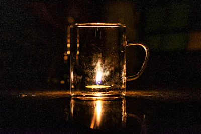Floating, frosted glass effect display of a custom printed mug with soft glowing highlights.