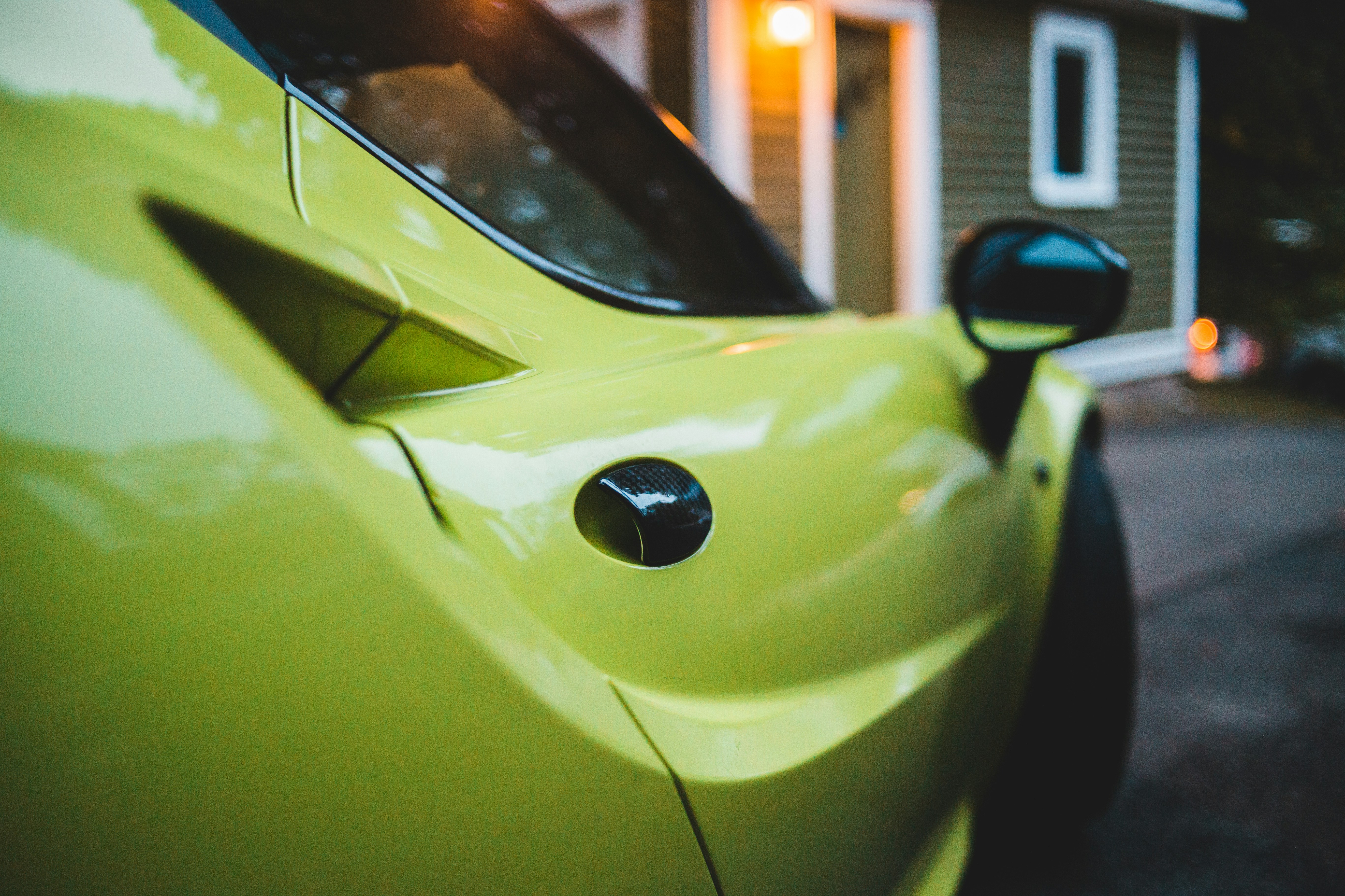 Smiling family reviewing paperwork while buying a used car at a dealership
