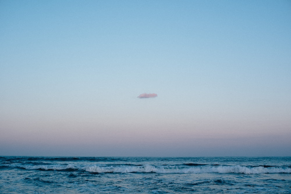 body of water under blue sky during daytime