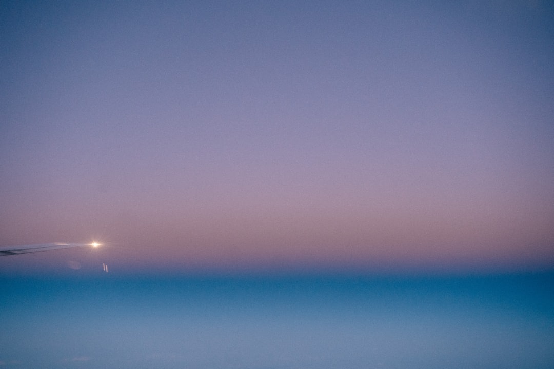 blue sky over body of water