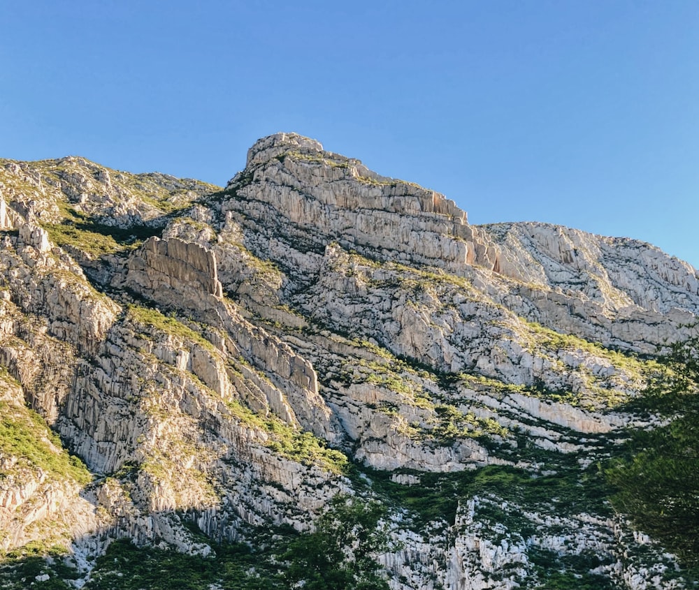 gray rocky mountain under blue sky during daytime