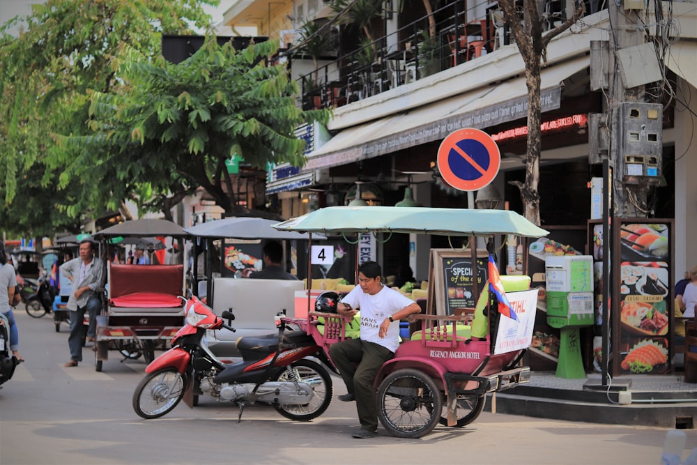 red and black motorcycle on road during daytime