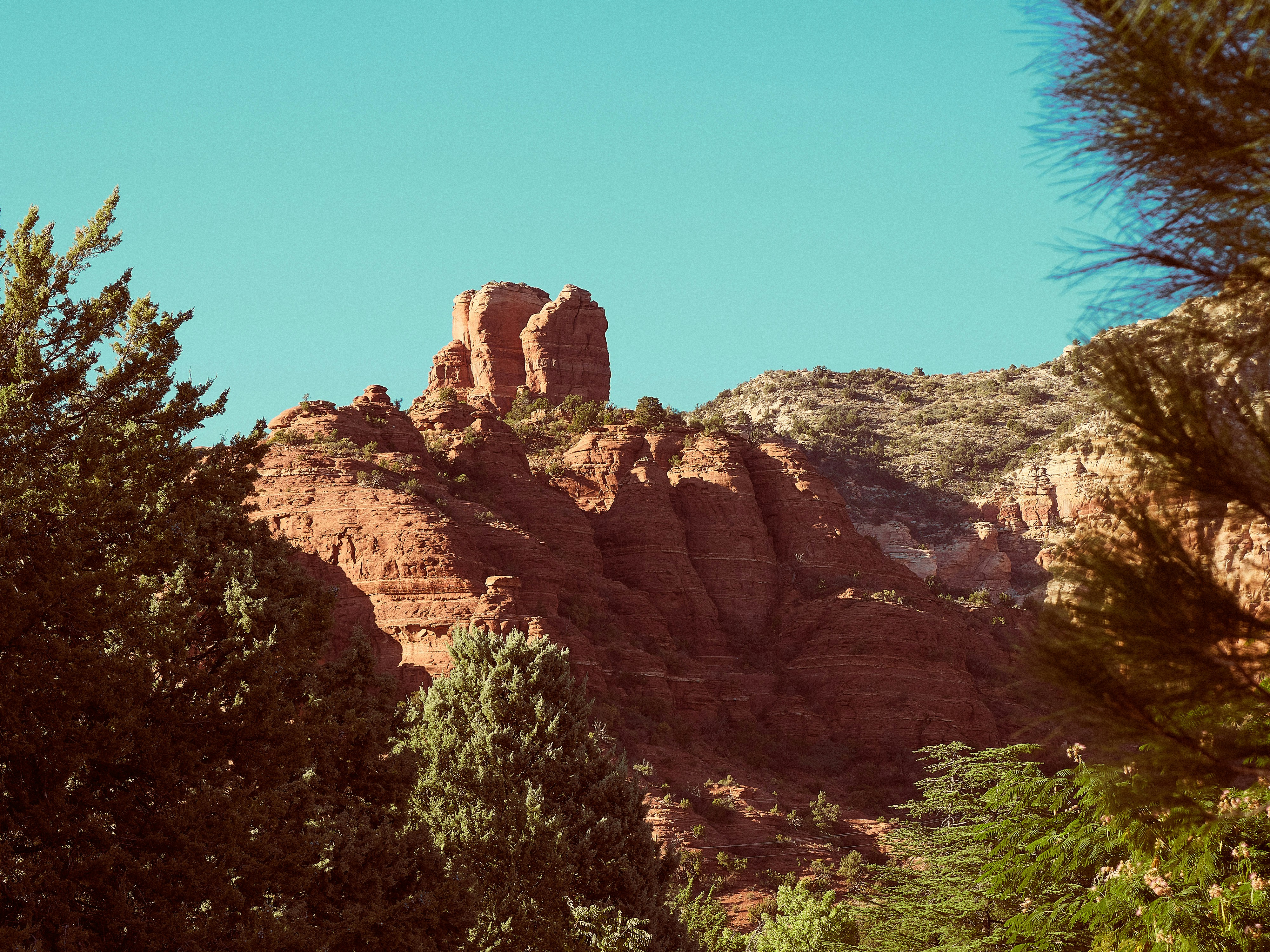 brown rocky mountain under blue sky during daytime