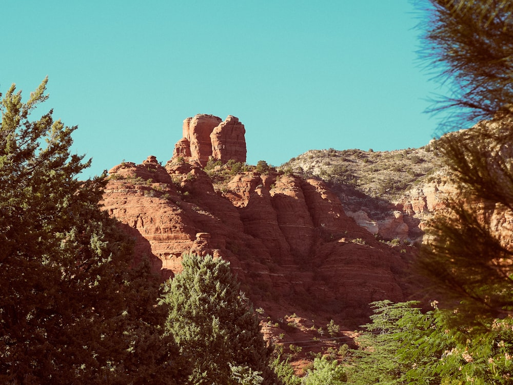 brown rocky mountain under blue sky during daytime