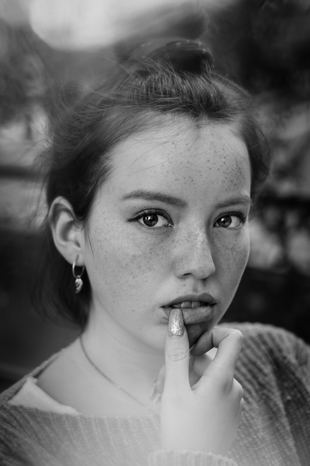 grayscale photo of woman with cigarette stick on her mouth