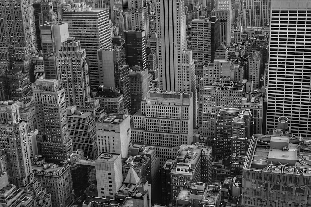 grayscale photo of city buildings during daytime