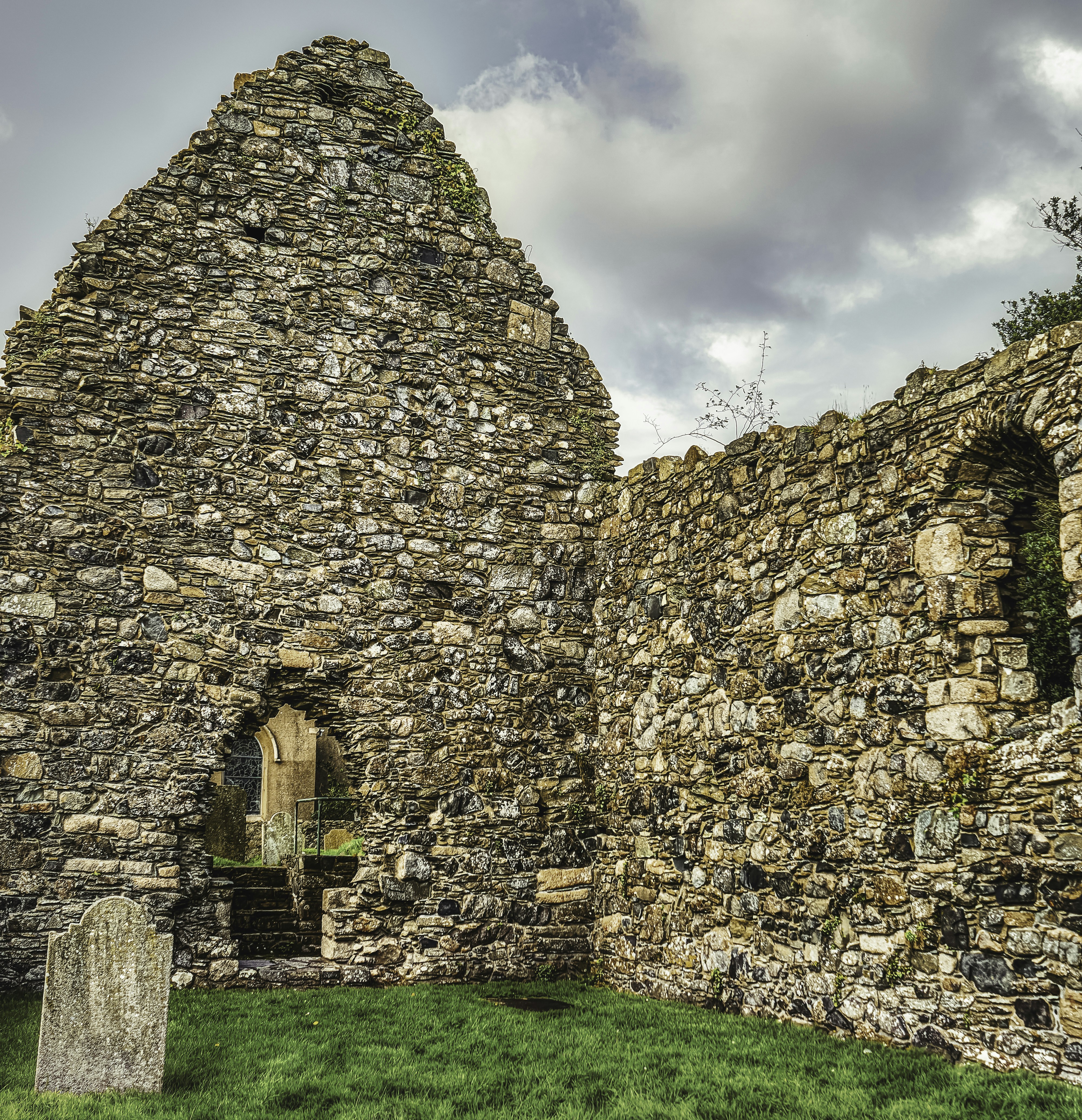 The ruins of a medieval, 13th Century, monastic church in Maghera, County Down. Some of the gravestones in the churchyard date to the Anglo-Saxon (450CE to 1066CE) and Norman (1066CE to 1204CE) periods which show that this area had religious significance prior to the building of this church (Sep., 2020).