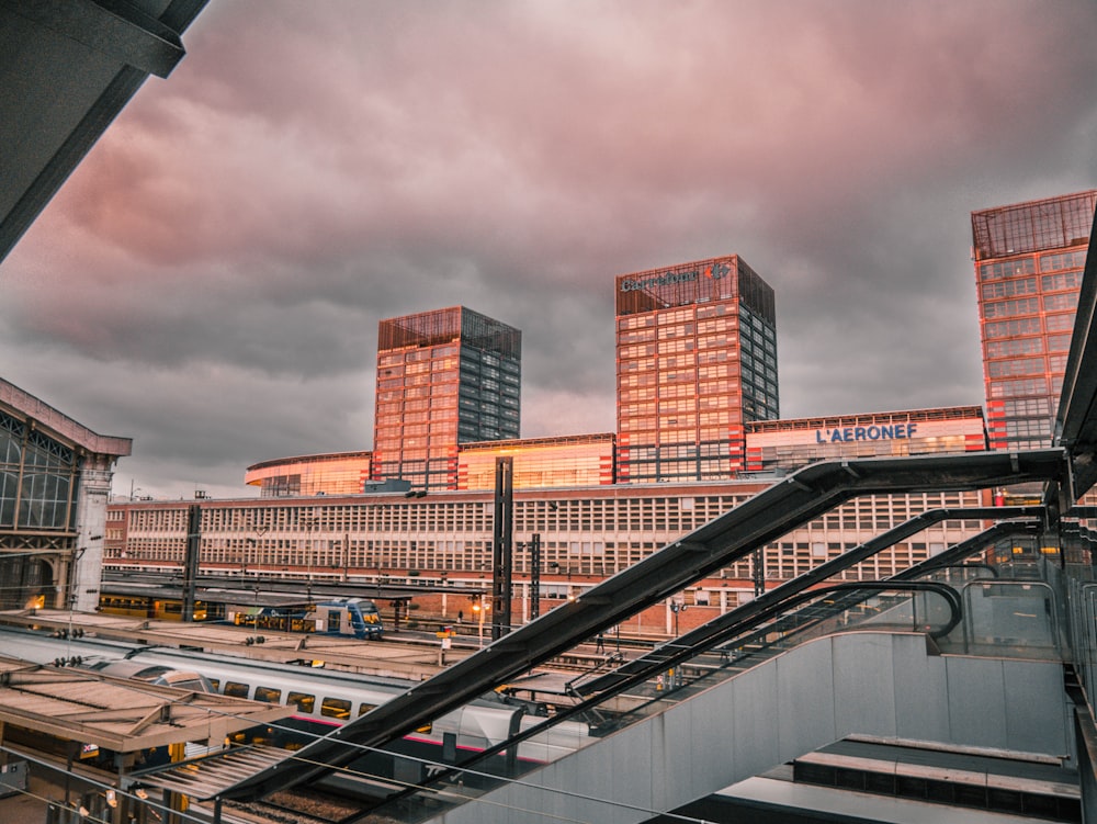 brown and white concrete building under gray sky