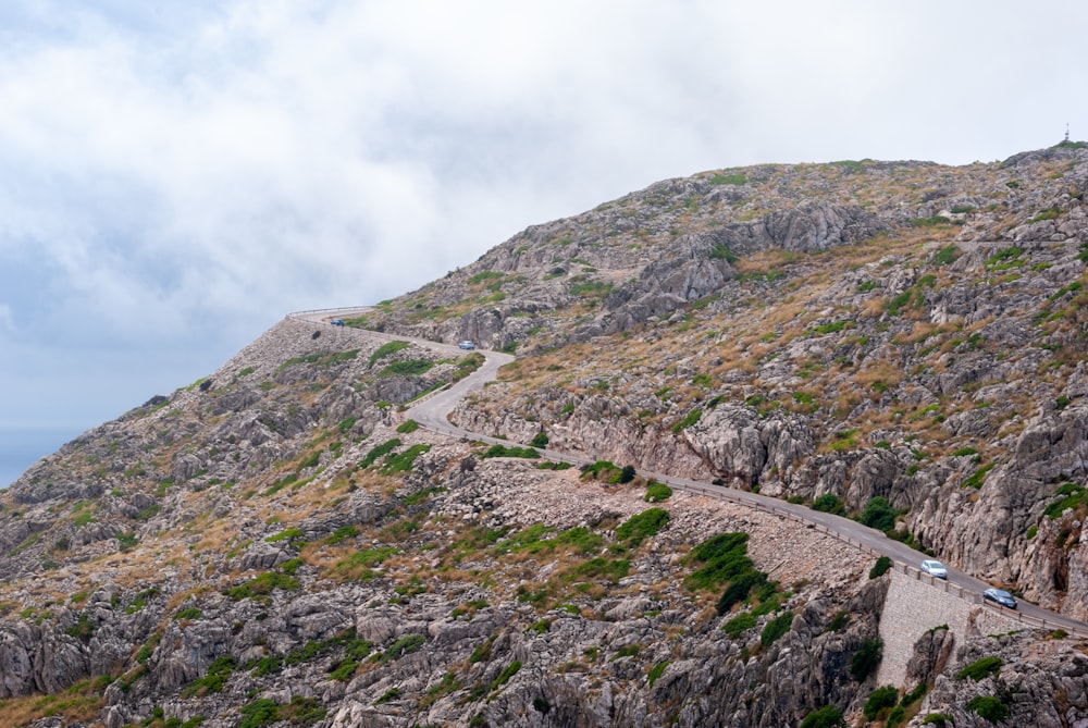 green and brown mountain under white clouds during daytime