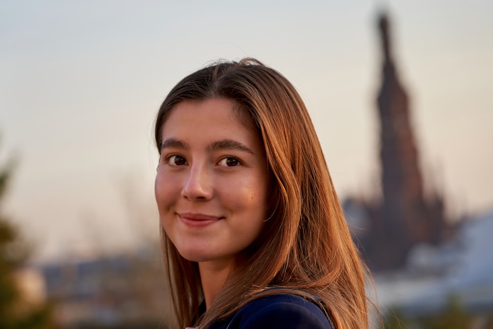 woman in blue shirt smiling