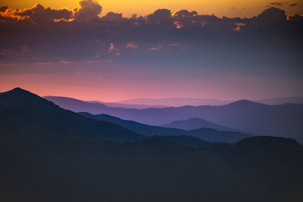 silhouette of mountains during sunset