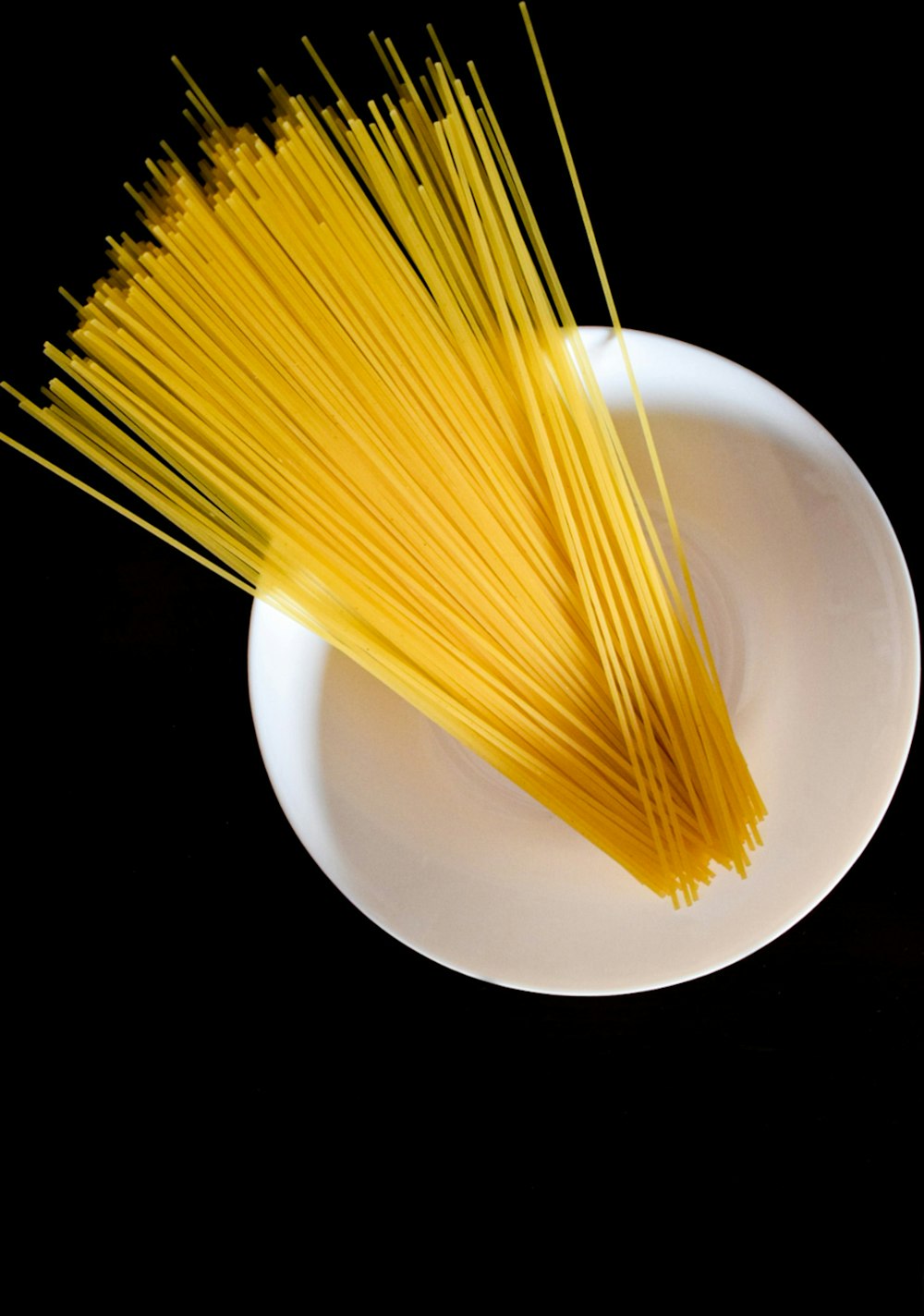 yellow brush on white ceramic plate