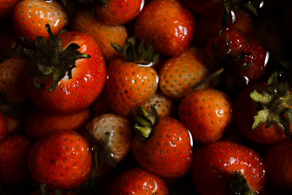 red strawberries on black surface