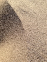 brown sand with shadow of person