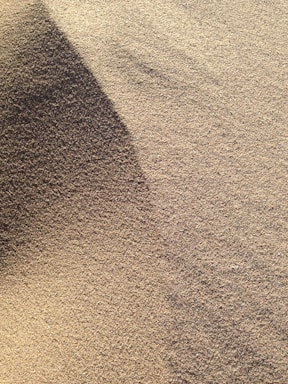 brown sand with shadow of person