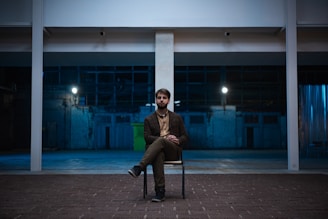 An intimate moment of a single man reflecting during a one-on-one coaching call.