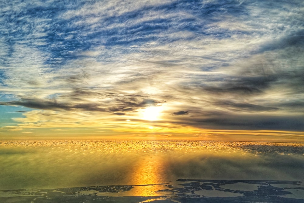 white clouds over the sea during daytime