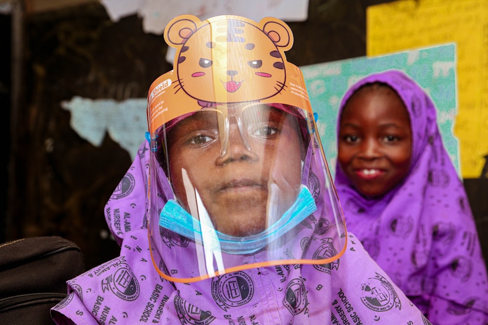 woman in purple hijab and white hijab