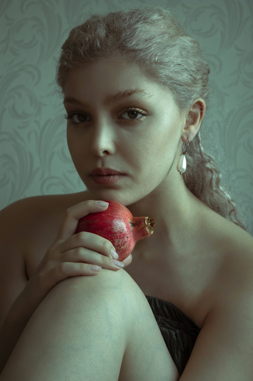 woman holding red apple fruit