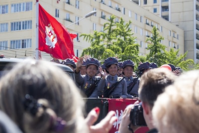 people gathering in front of building during daytime