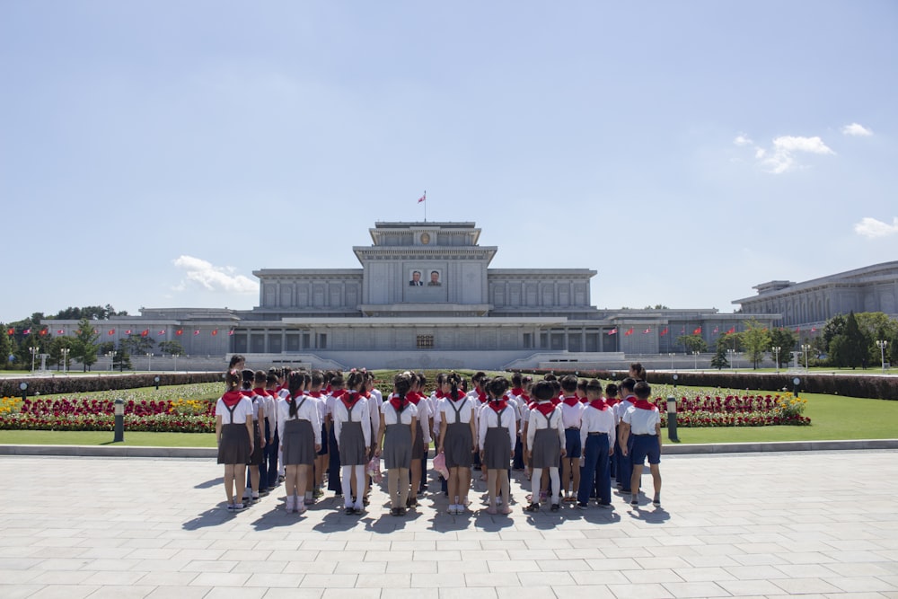 people standing on white concrete floor during daytime