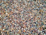 Colorful limestone pebbles spread out to show variety.