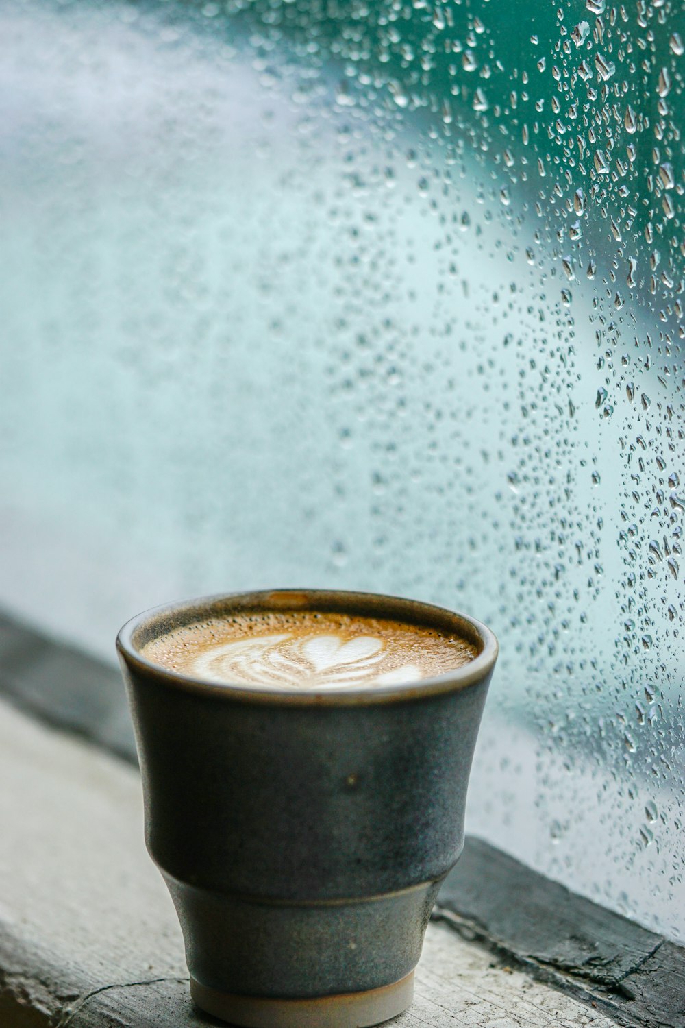 black ceramic mug with coffee