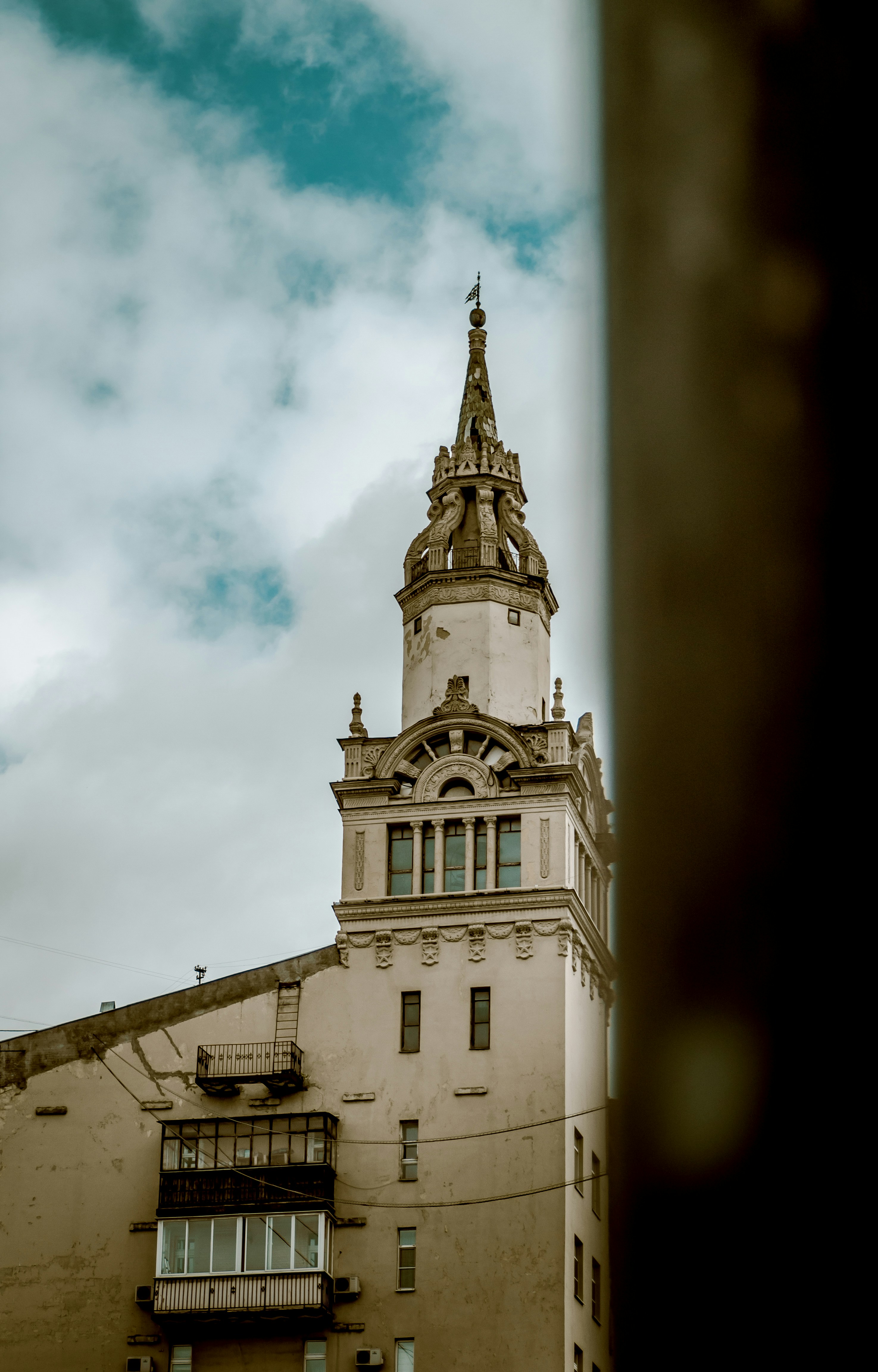 white concrete building under cloudy sky