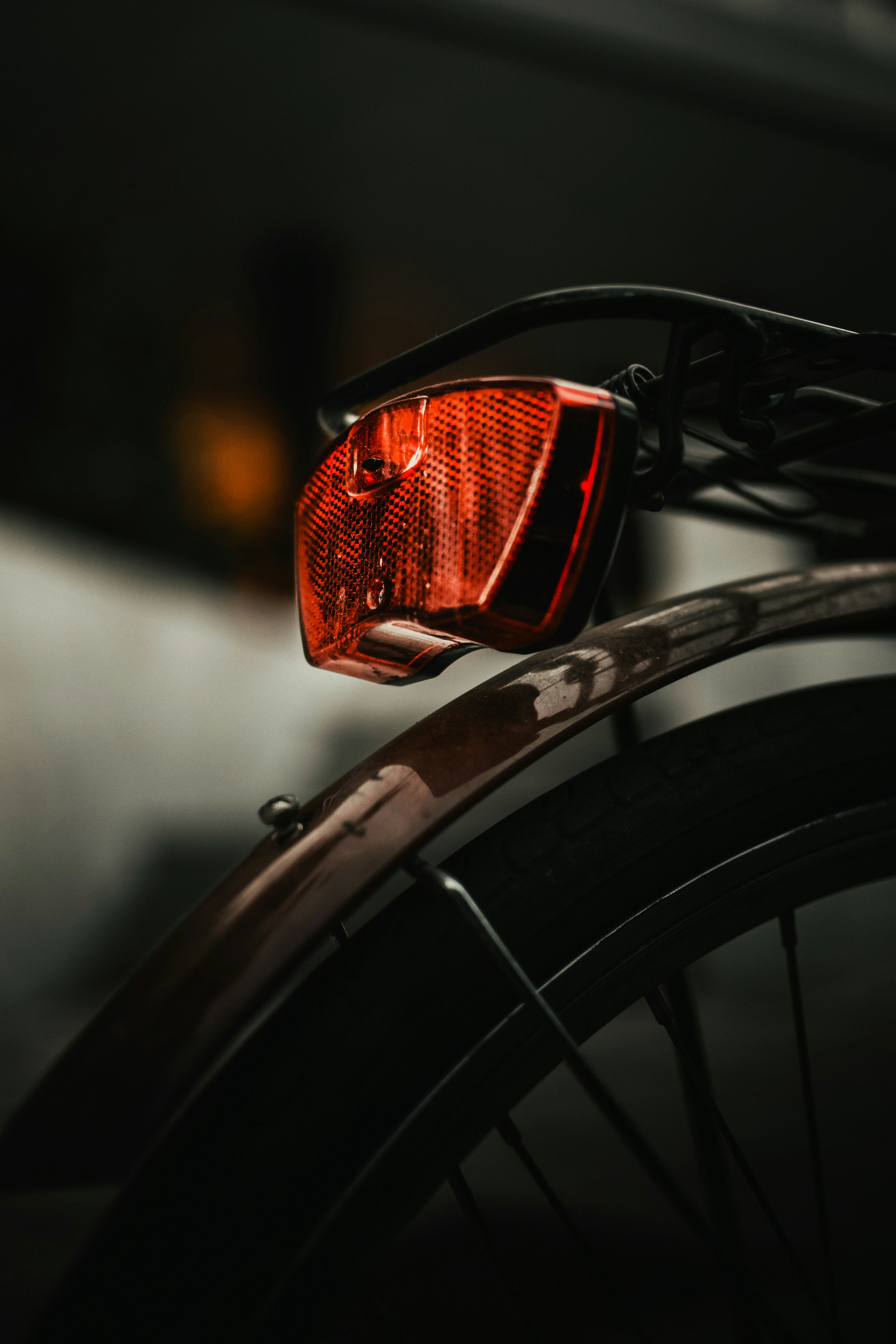black bicycle wheel with orange light