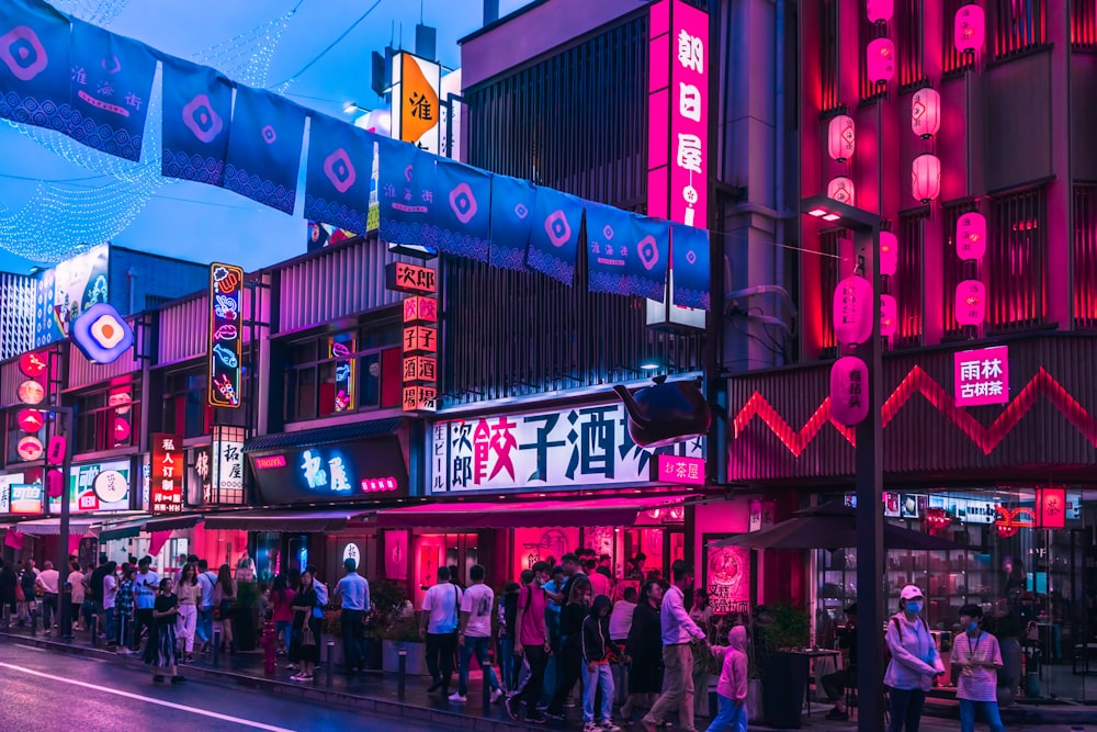 people walking on street during night time