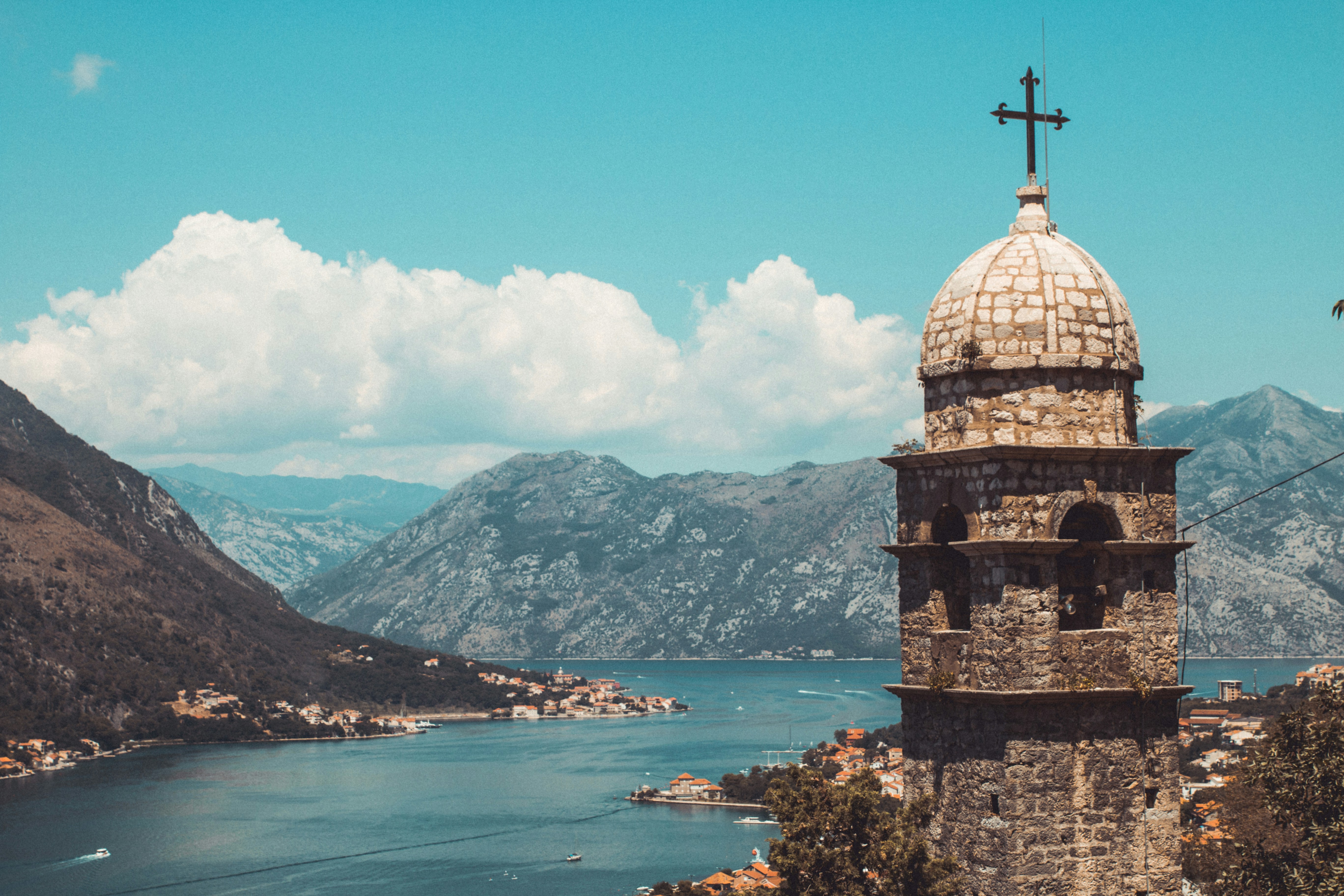 brown concrete building near body of water during daytime