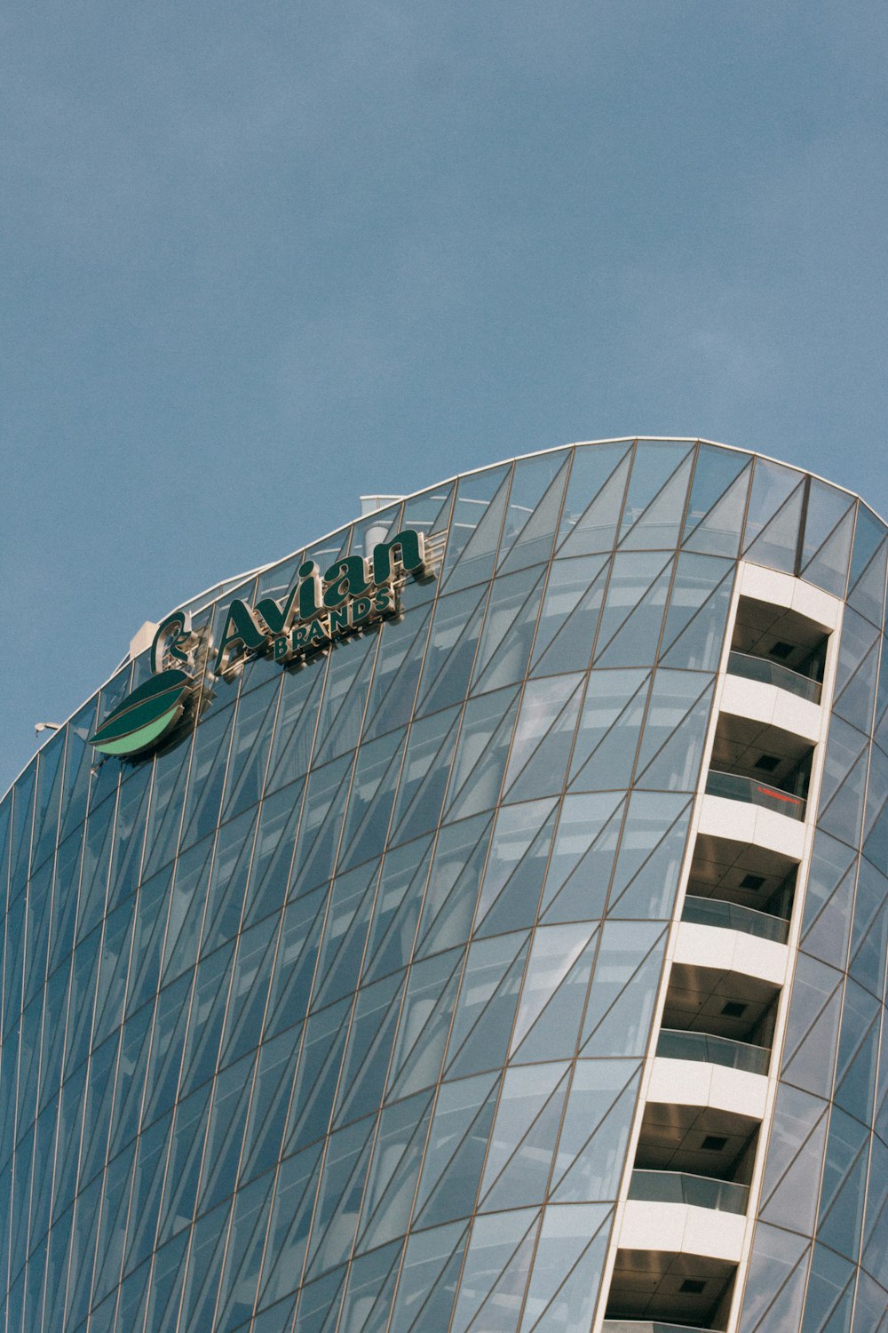 white and green concrete building under blue sky during daytime