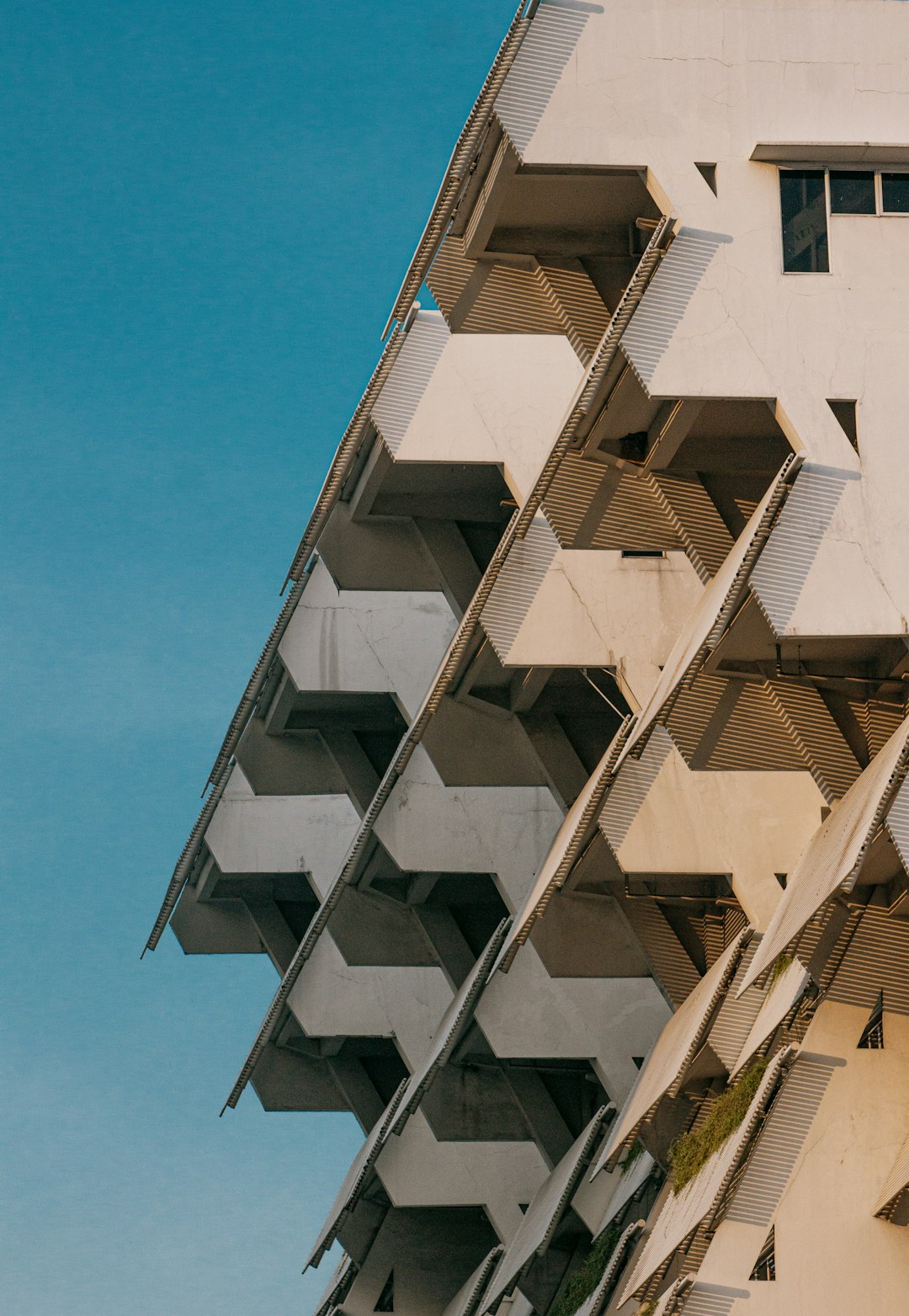 white concrete building under blue sky during daytime