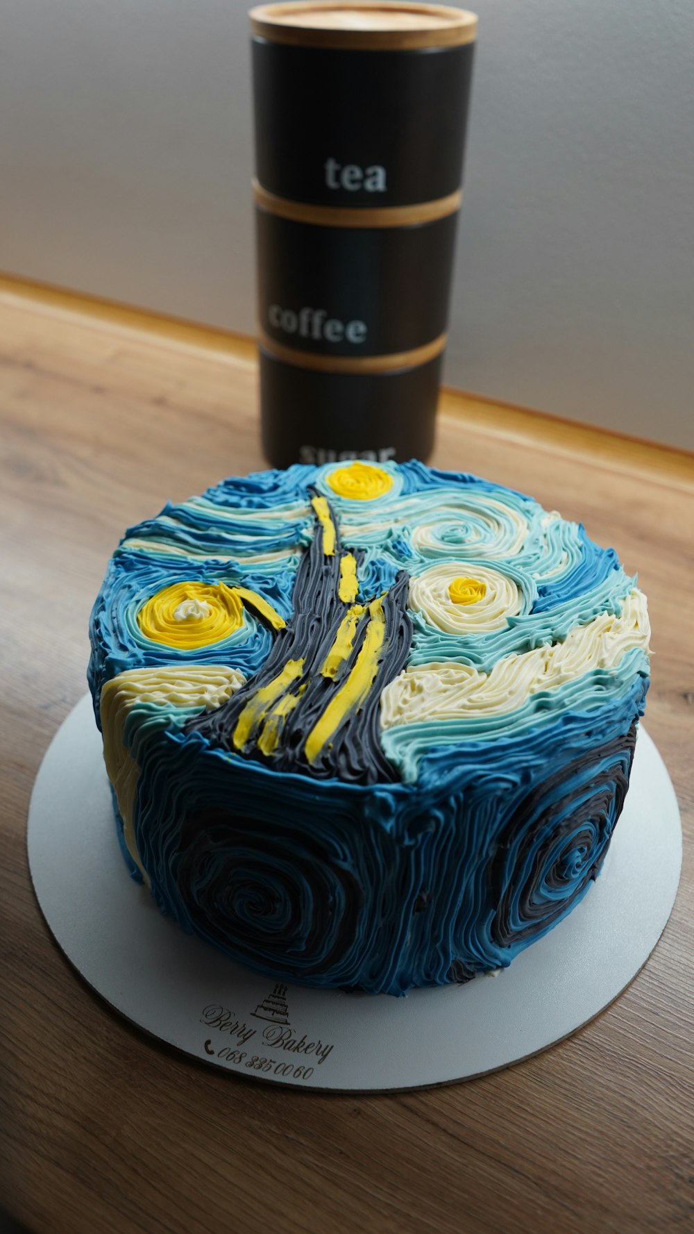 blue and yellow cake on white ceramic plate