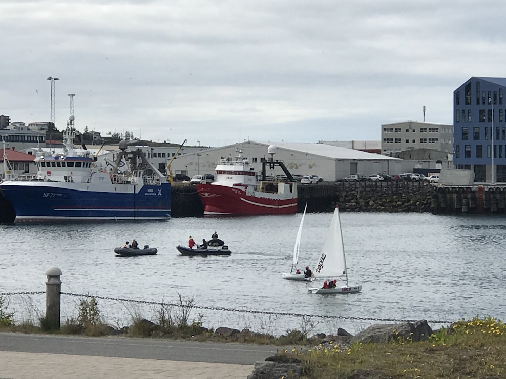 blue and white boat on water during daytime