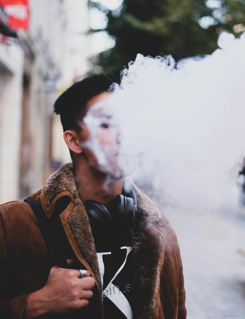 man in brown leather jacket