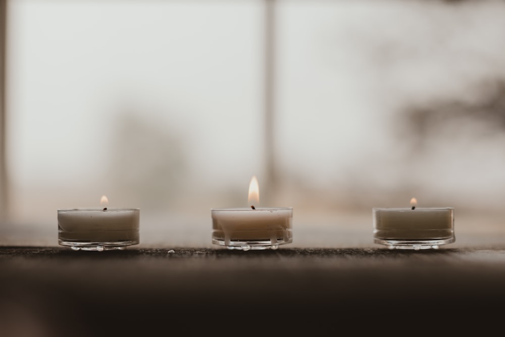 white candles on white table