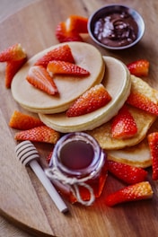 sliced strawberries on white ceramic plate
