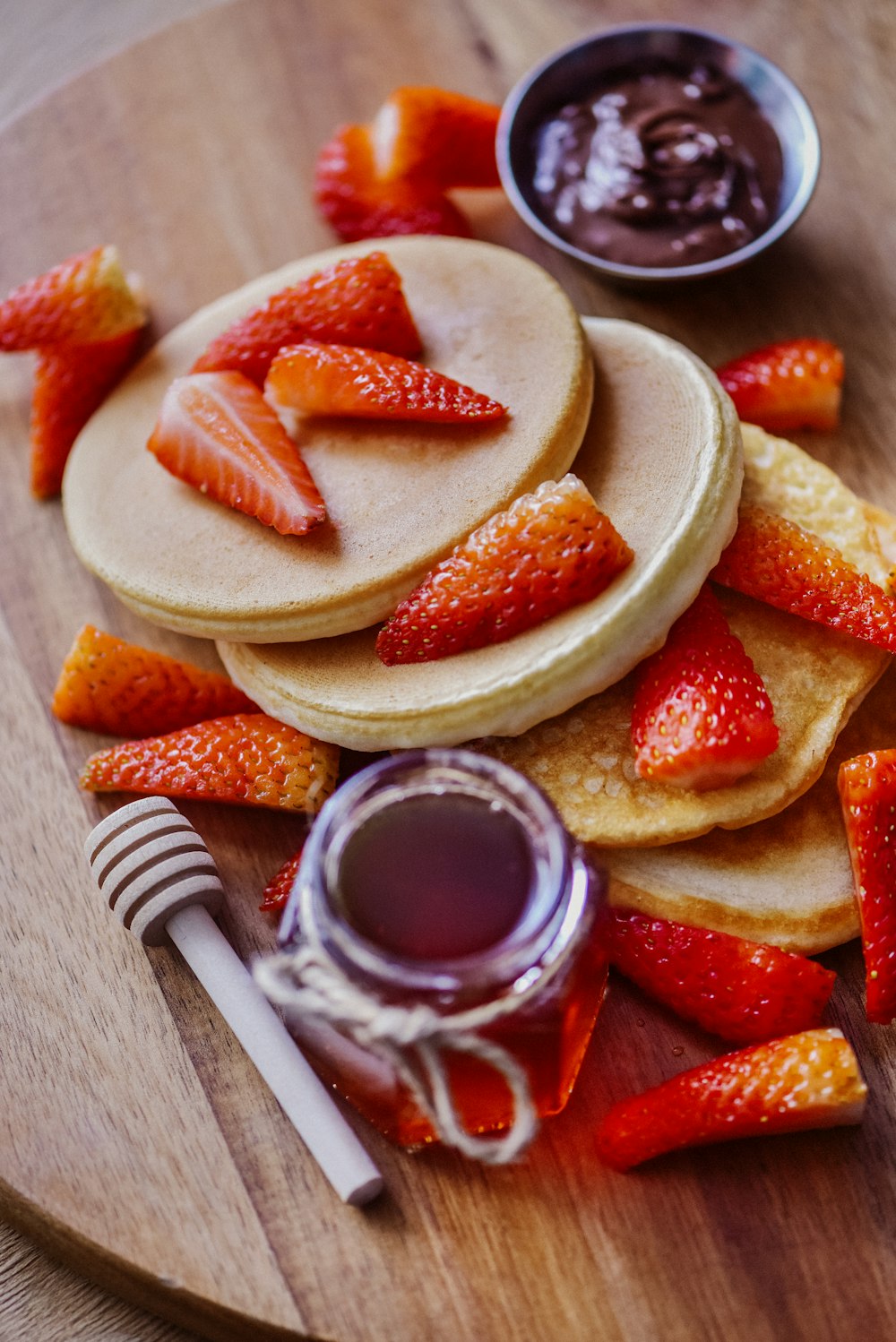 sliced strawberries on white ceramic plate