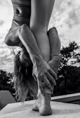 A focused handstand pose held confidently against a clear sky