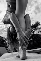 A person stretching outdoors, showcasing joint flexibility.
