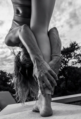 A focused handstand pose held confidently against a clear sky