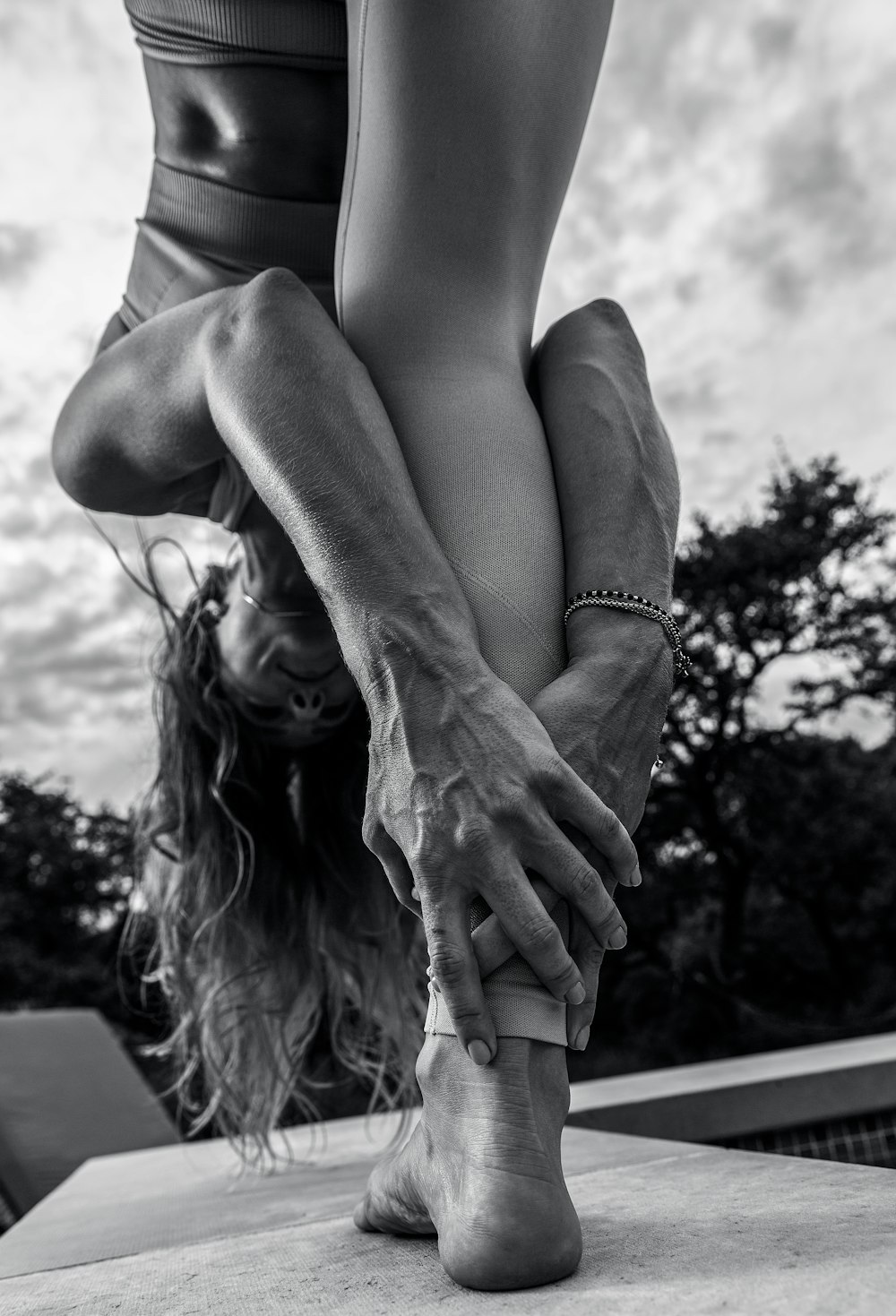 grayscale photo of woman wearing silver bracelet