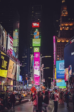 people walking on street during nighttime