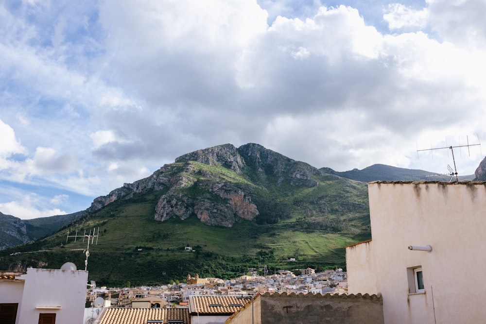 green mountain under cloudy sky during daytime