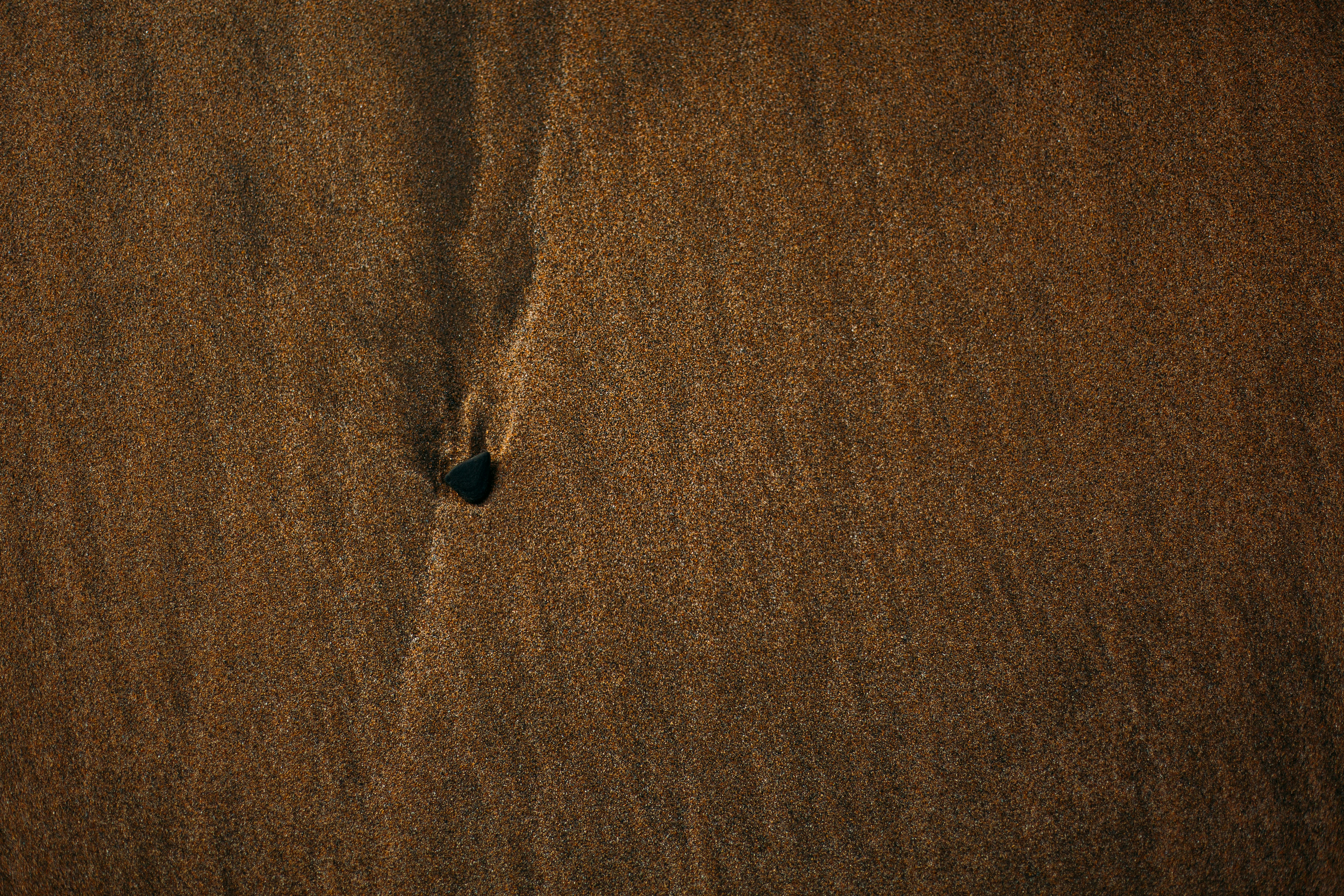 black stone on brown textile