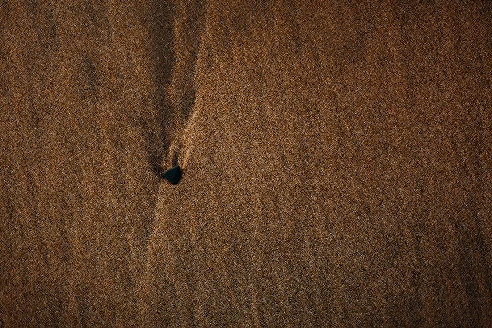 black stone on brown textile