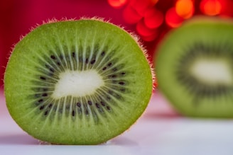 A close-up of fresh kiwi seeds glistening under natural light.