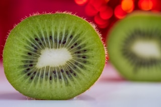 sliced green fruit on white table