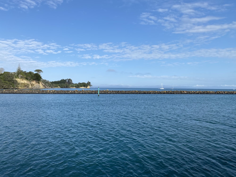 blue sea under blue sky during daytime